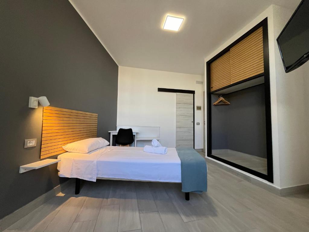 Postel nebo postele na pokoji v ubytování Hotel Pensión Cassandra