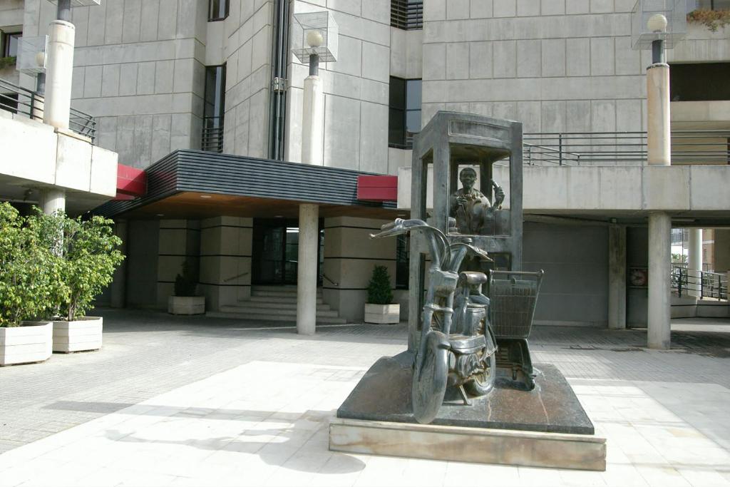 a statue in front of a building at Apartamentos Santa Margarita - Arca Rent in Benidorm