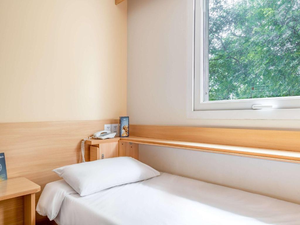 Postel nebo postele na pokoji v ubytování ibis Lima Larco Miraflores