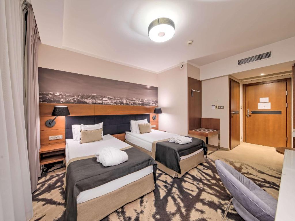 Posteľ alebo postele v izbe v ubytovaní Mercure Bydgoszcz Sepia