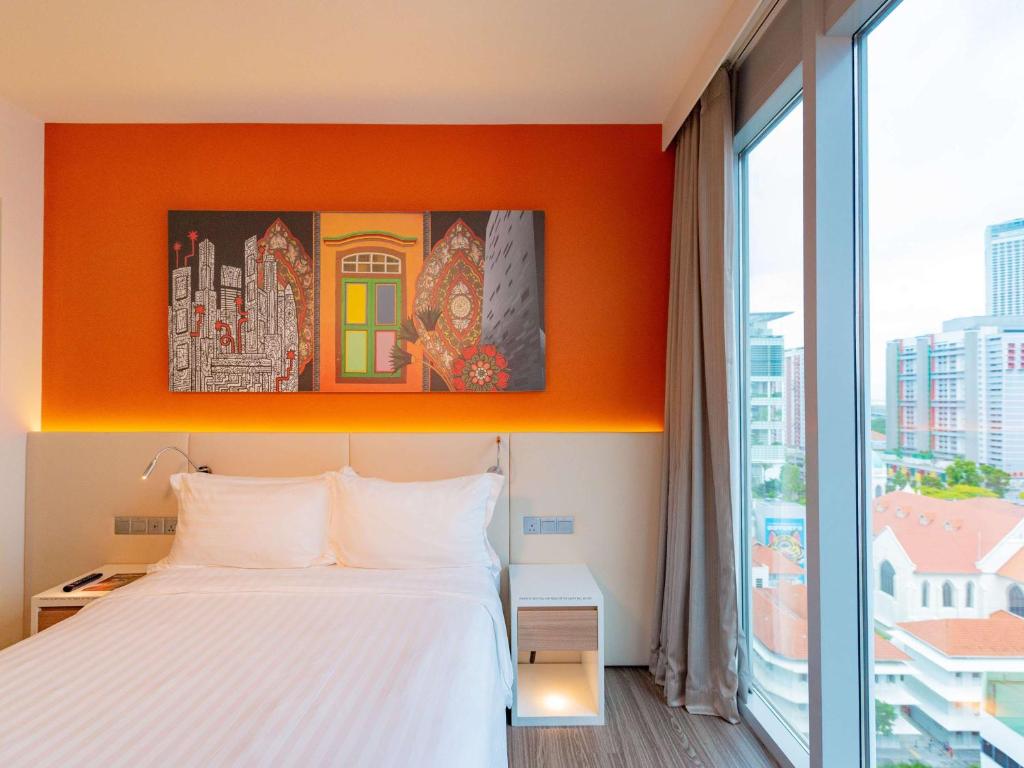 Кровать или кровати в номере Mercure Singapore Bugis