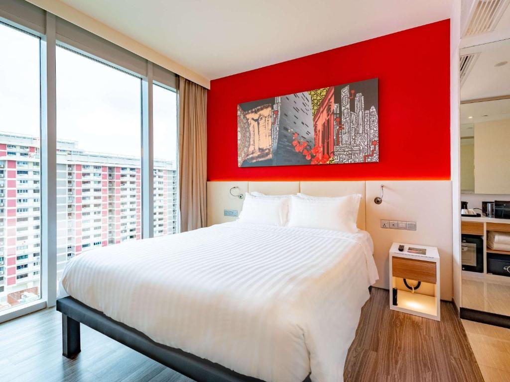 Кровать или кровати в номере Mercure Singapore Bugis