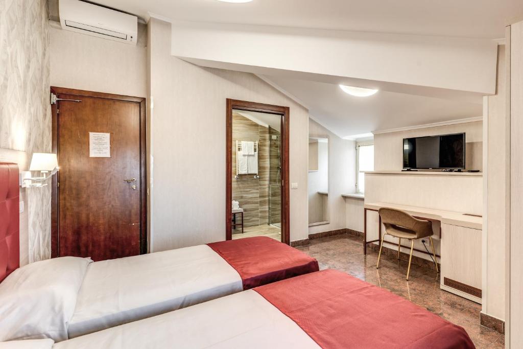 Postel nebo postele na pokoji v ubytování Hotel Milo