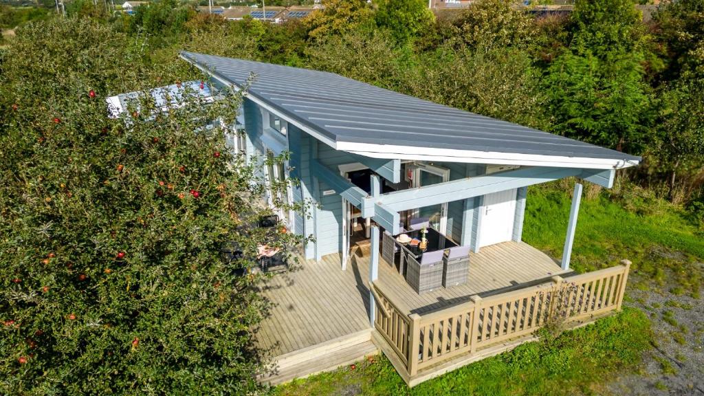 an overhead view of a house with a roof at Broadpath, Great Field Lodges in Braunton