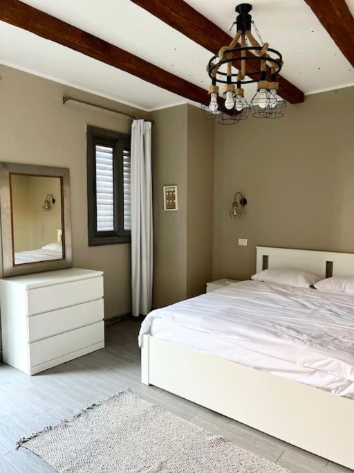 Postel nebo postele na pokoji v ubytování 1BR villa - private heated pool in Bali ElGouna