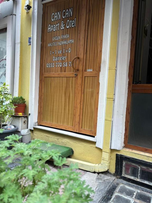 a front door of a building with a sign on it at Efe Can Apart Otel in Çanakkale