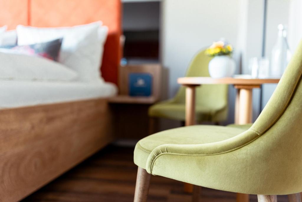 Postel nebo postele na pokoji v ubytování Hotel am Schwanenhaus