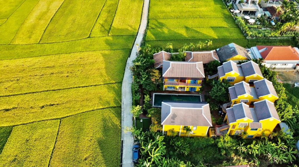 una vista aerea di una casa in un campo di Chez Mimosa Hoi An - LUA Retreat a Hoi An