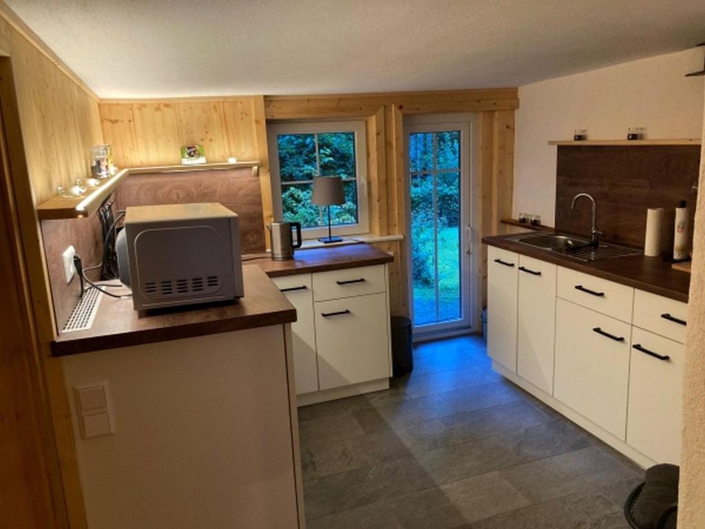 Kuchyň nebo kuchyňský kout v ubytování Waldbauernhof