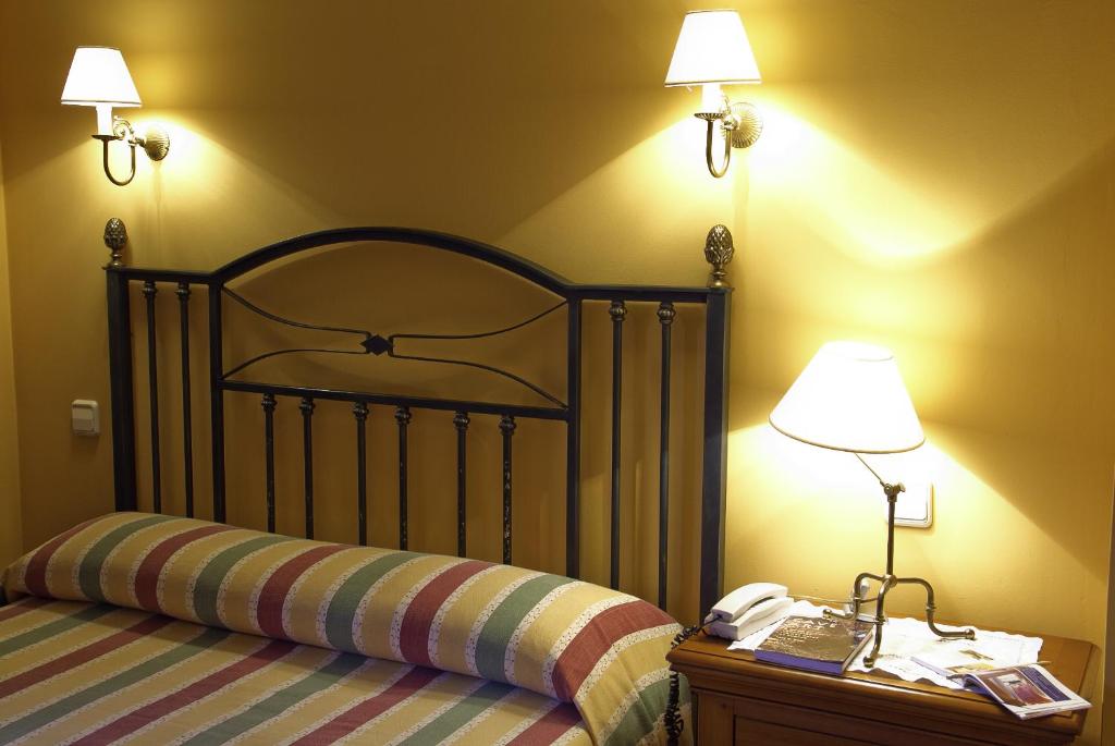 Cama o camas de una habitación en Posada La Casona de Los Güelitos