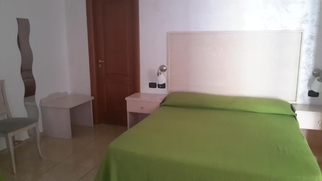 Postel nebo postele na pokoji v ubytování Hotel Miramare