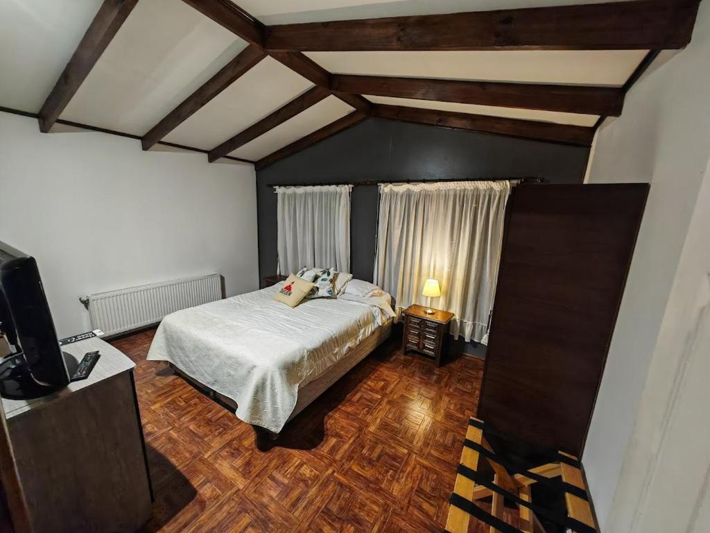 Uma cama ou camas num quarto em SHEUEN PATAGONIA