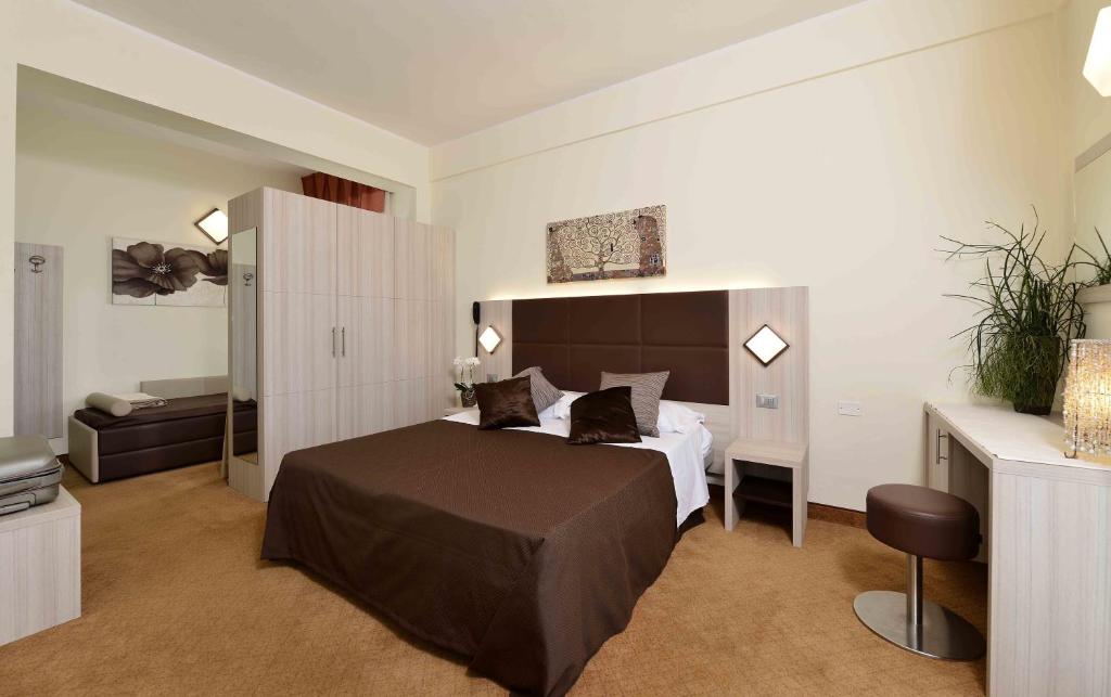 Postel nebo postele na pokoji v ubytování Hotel Doge