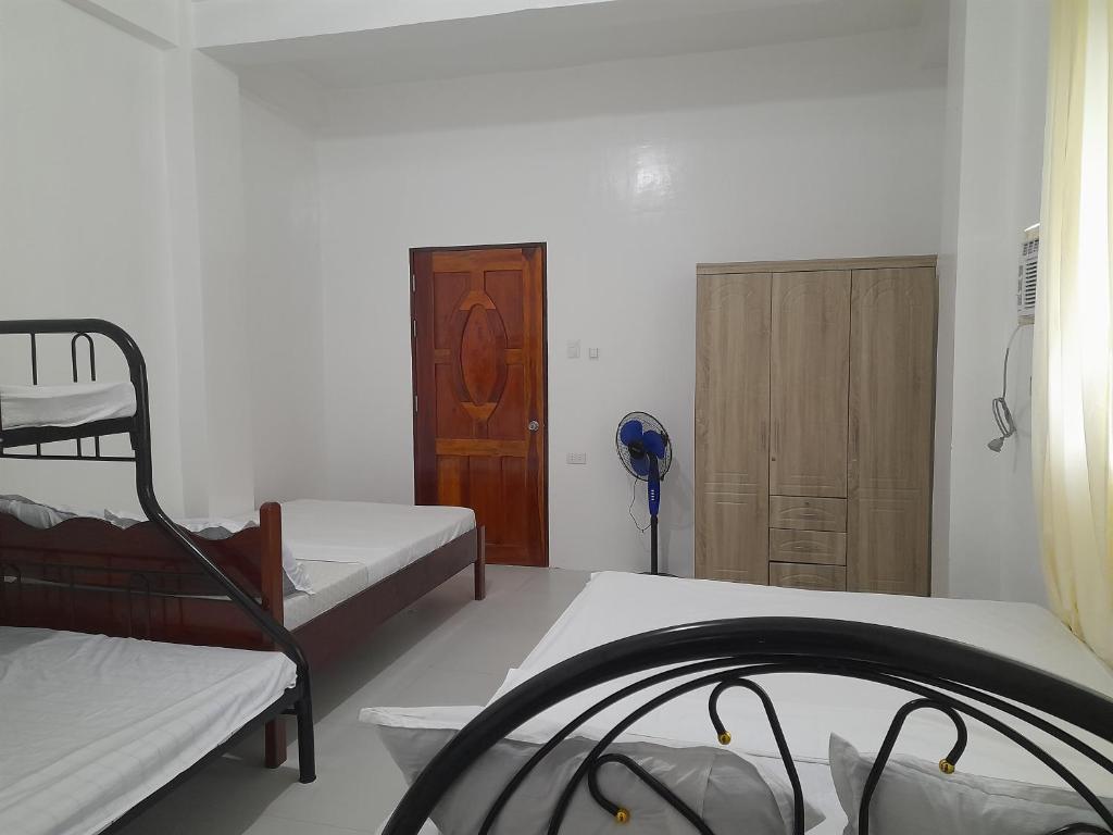 Postel nebo postele na pokoji v ubytování Noguerra Homestay