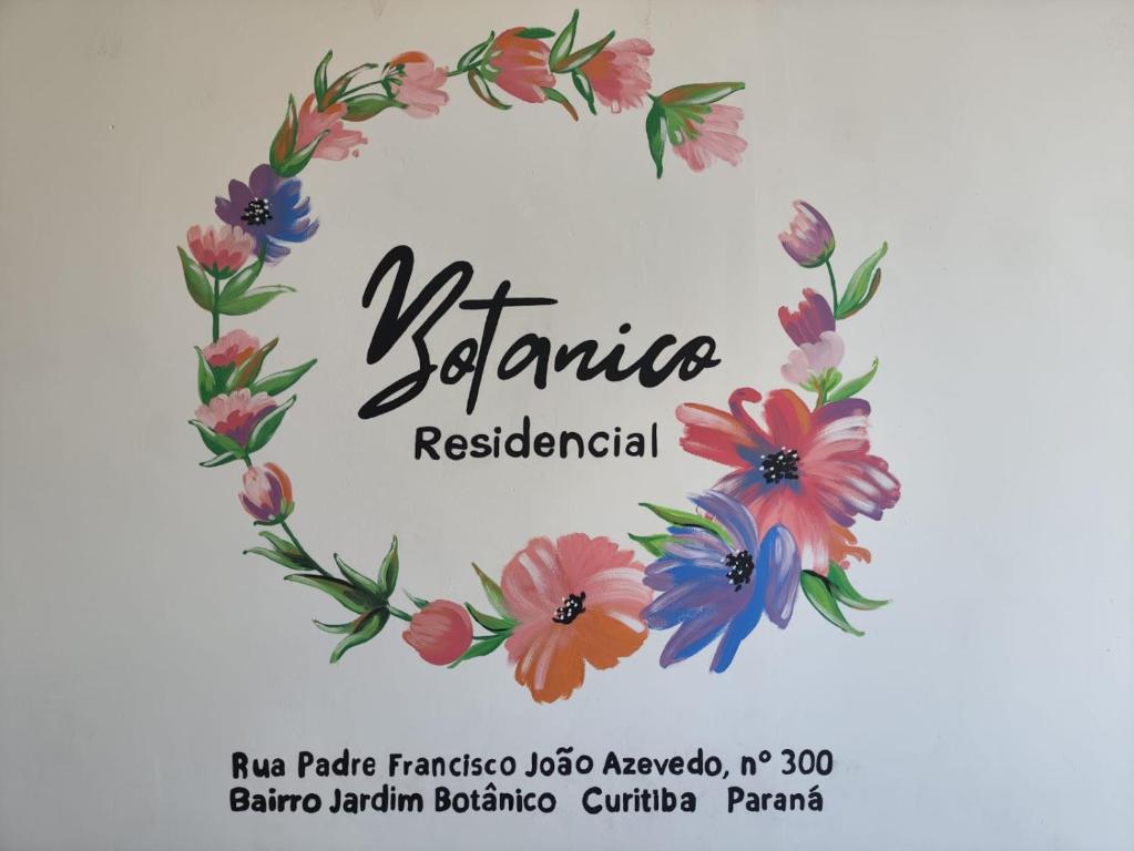 une couronne de fleurs avec un panneau pour un restaurant dans l'établissement RESIDENCIAL BOTÂNICO, à Curitiba