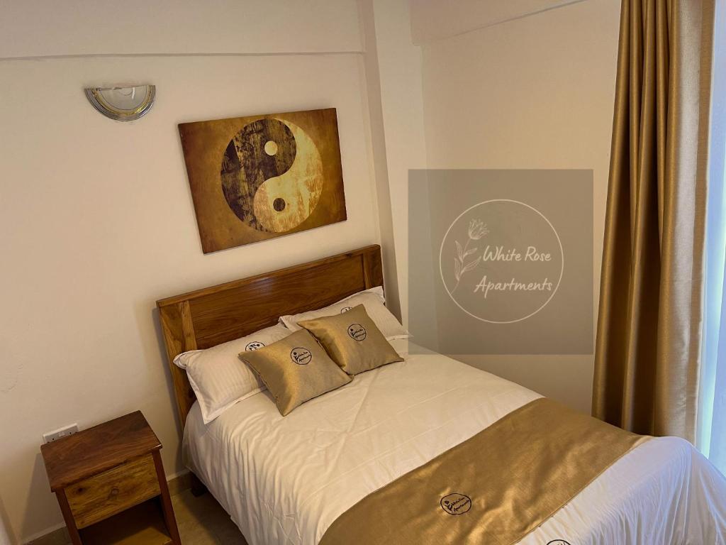 Postel nebo postele na pokoji v ubytování WhiteRose Apartments