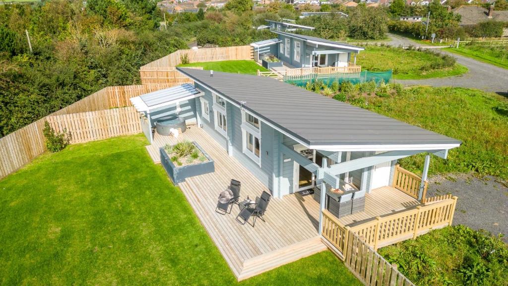 an overhead view of a house with a deck at Middle Thorne, Great Field Lodges in Braunton