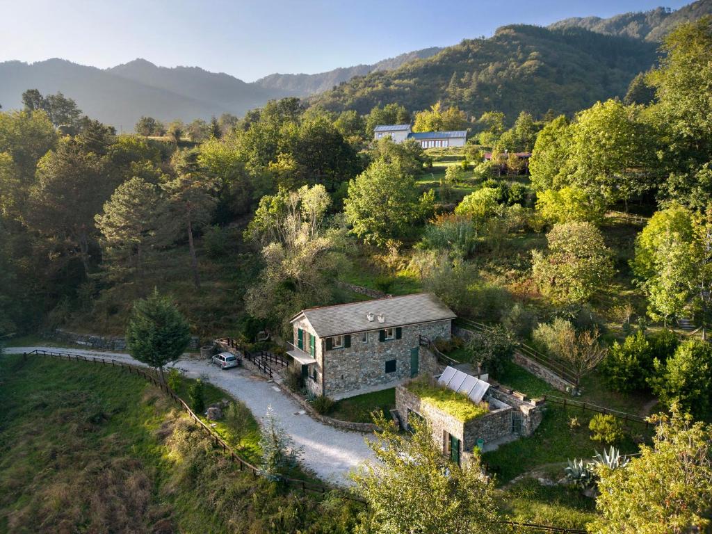 an aerial view of a house on a hill at Il Mulino - Appartamento Terra in Borzonasca