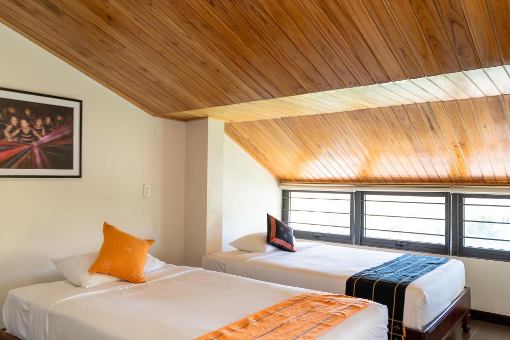 Postel nebo postele na pokoji v ubytování Virgo Villa Quê Hội An
