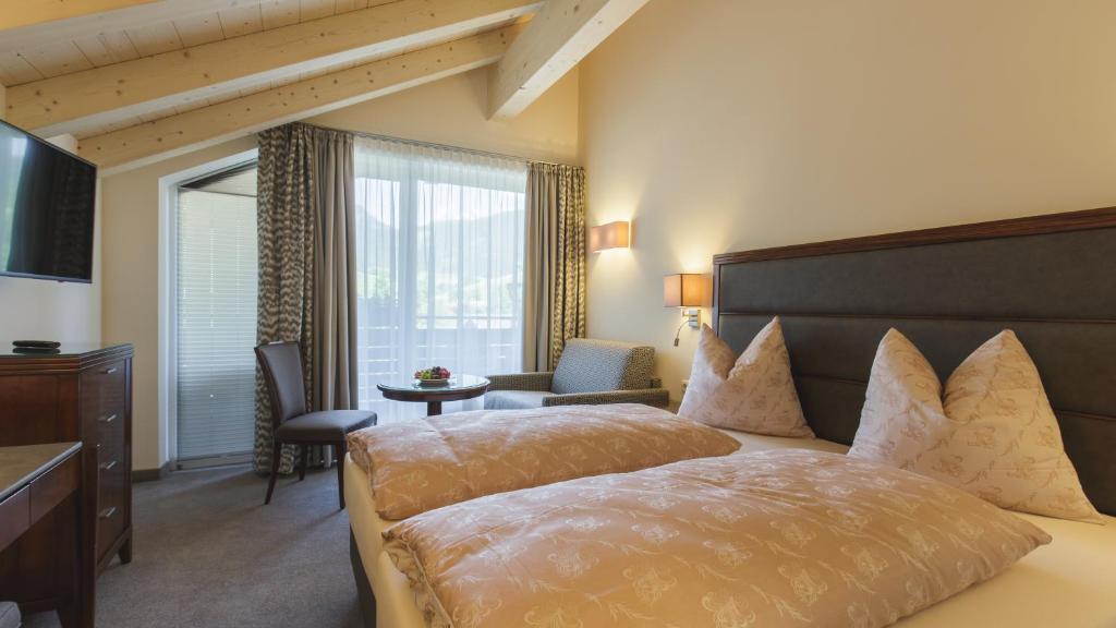 A bed or beds in a room at Hotel Niederreiter