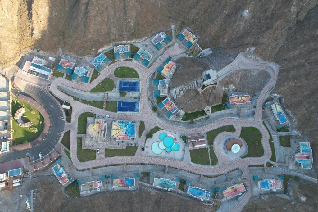 an aerial view of a building in a mountain at Dibba Mountain Park Resort in Fujairah