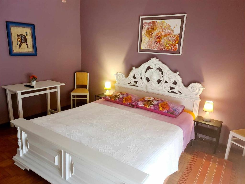 Postel nebo postele na pokoji v ubytování V.home