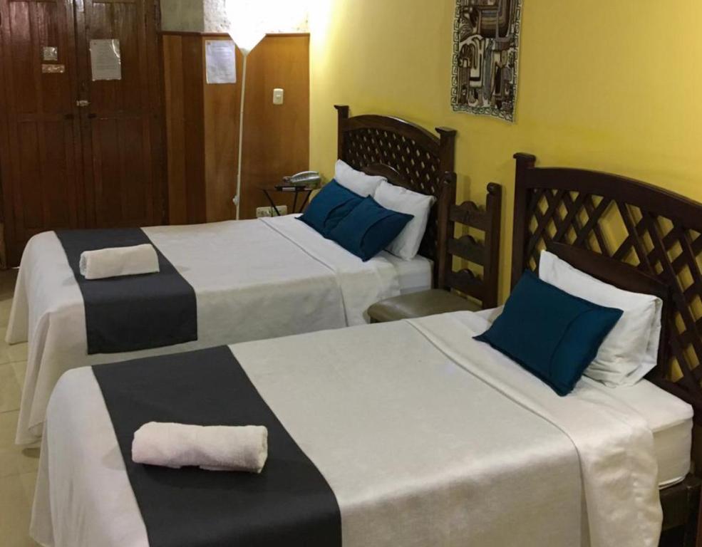 Postel nebo postele na pokoji v ubytování Hostal La Posada Del Sol