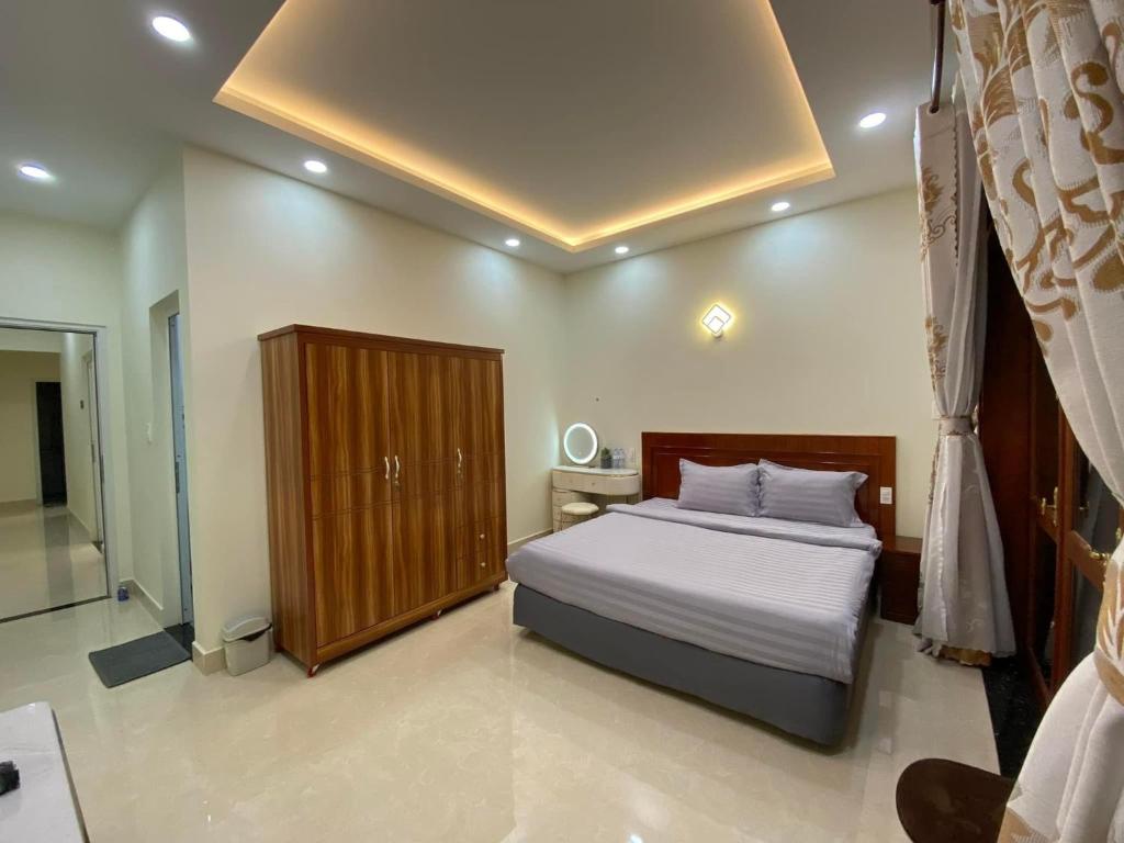 Postel nebo postele na pokoji v ubytování Da Quy Harmony Homestay