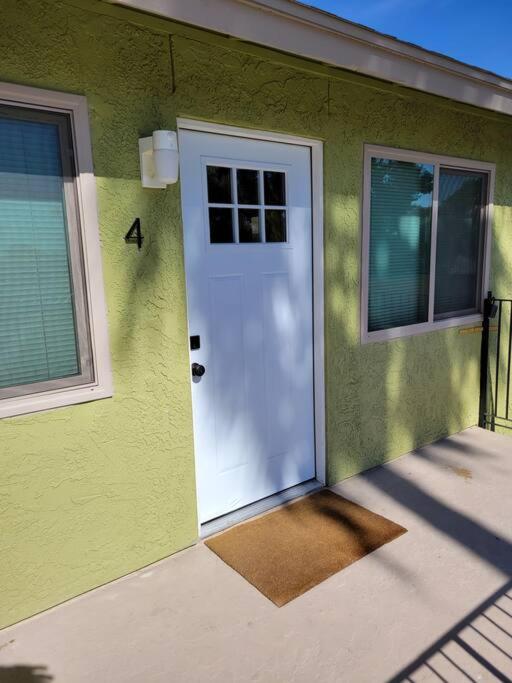 a green house with a white door and windows at *Msg for 5%off*2Bed1Bath QueenBeds NorthPHX in Phoenix