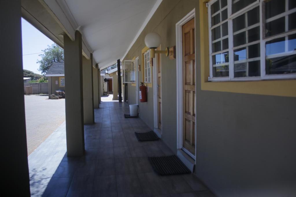 an empty hallway of a building with a door at Palapye Guest House in Palatswe