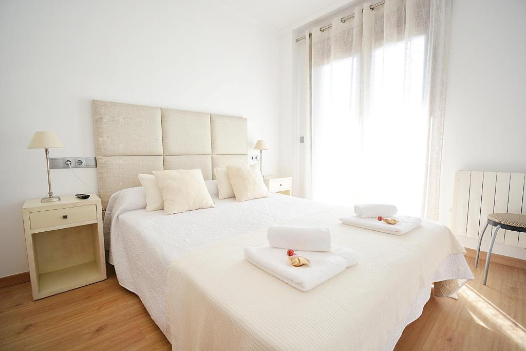 Säng eller sängar i ett rum på Apartamento Vila do Albariño