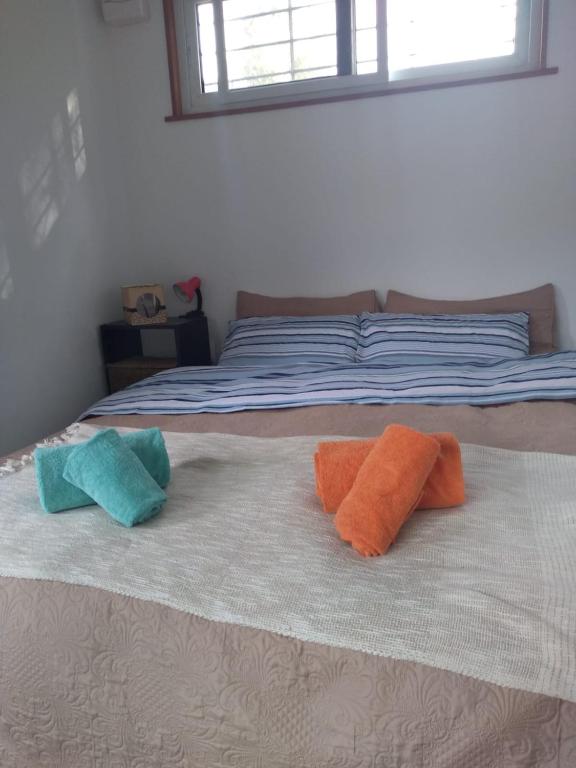 Postel nebo postele na pokoji v ubytování Aguaymanto