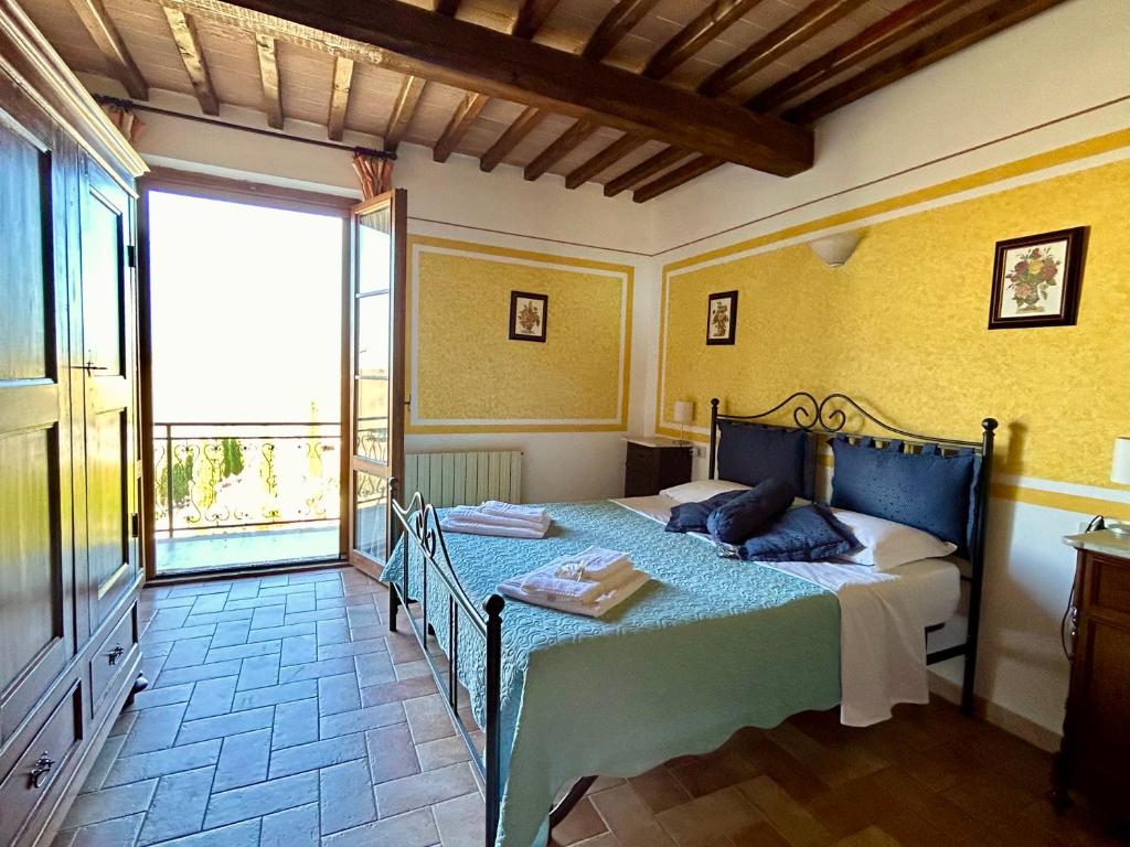 Posteľ alebo postele v izbe v ubytovaní Poggiosalto in Toscana