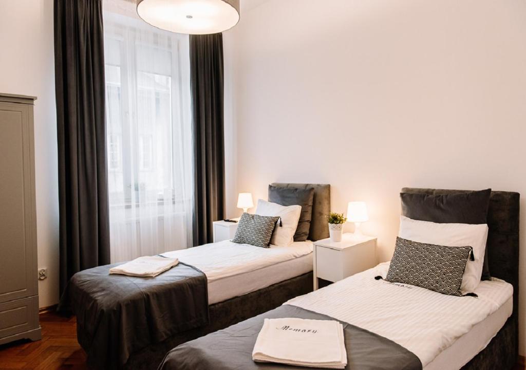 Posteľ alebo postele v izbe v ubytovaní Memory Apartments