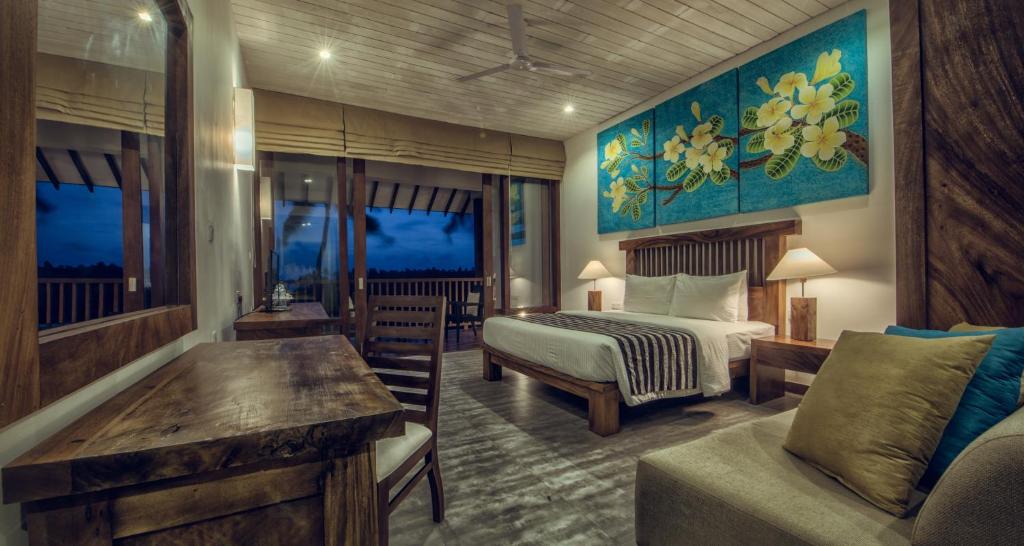 Postel nebo postele na pokoji v ubytování Suriya Resort