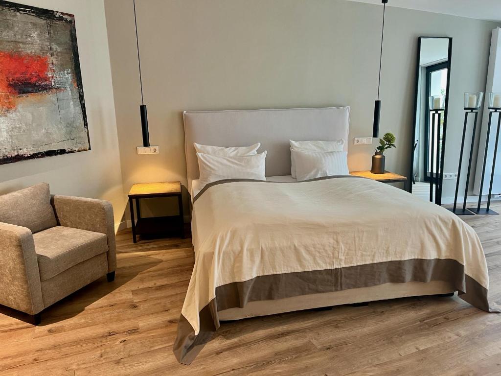 Postel nebo postele na pokoji v ubytování Galerie Hotel