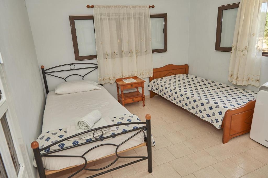 Postel nebo postele na pokoji v ubytování Villa Rania / Zante Drosia