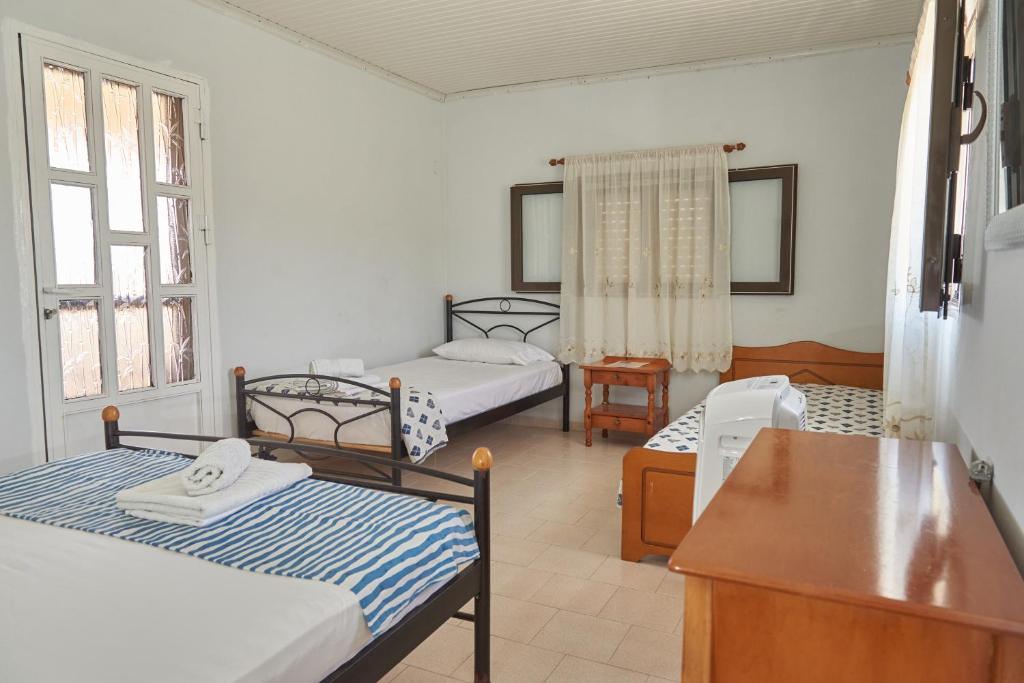 Postel nebo postele na pokoji v ubytování Villa Rania / Zante Drosia