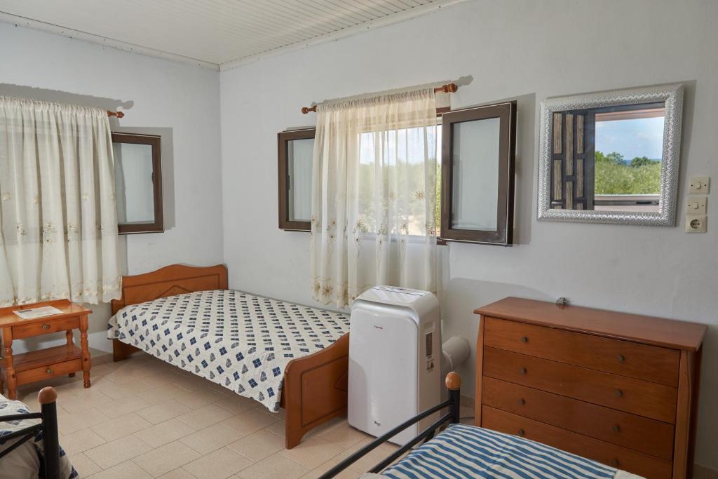 Postel nebo postele na pokoji v ubytování Villa Rania / Zante Drosia