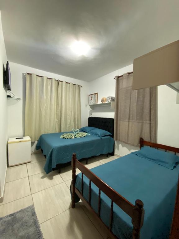 Кровать или кровати в номере Pousada econômica bon vivant arraial do cabo