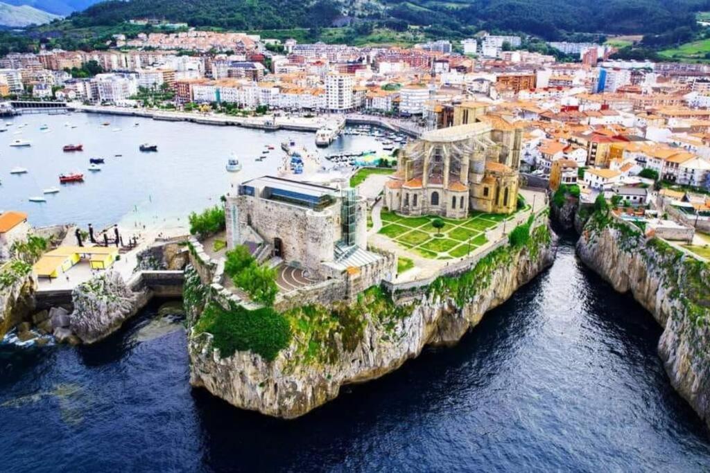 an aerial view of a city and a body of water at Jumeke Home in Castro-Urdiales