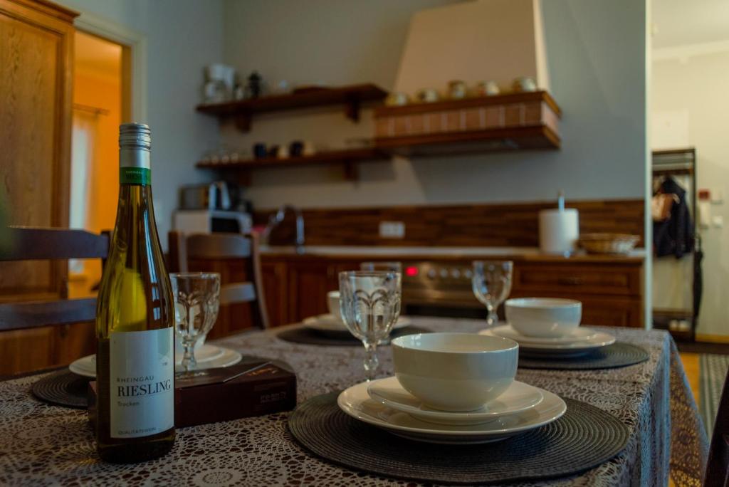 a bottle of wine sitting on top of a table at Romeo Family Apartments in Tallinn