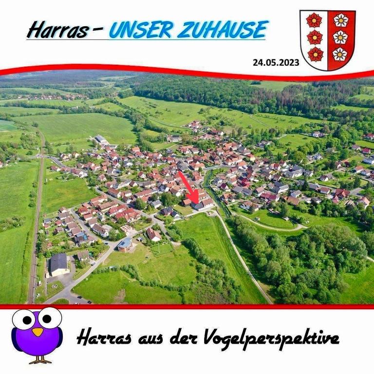 a map of a town with a bird on it at Ferienwohnung Storchennest in Eisfeld