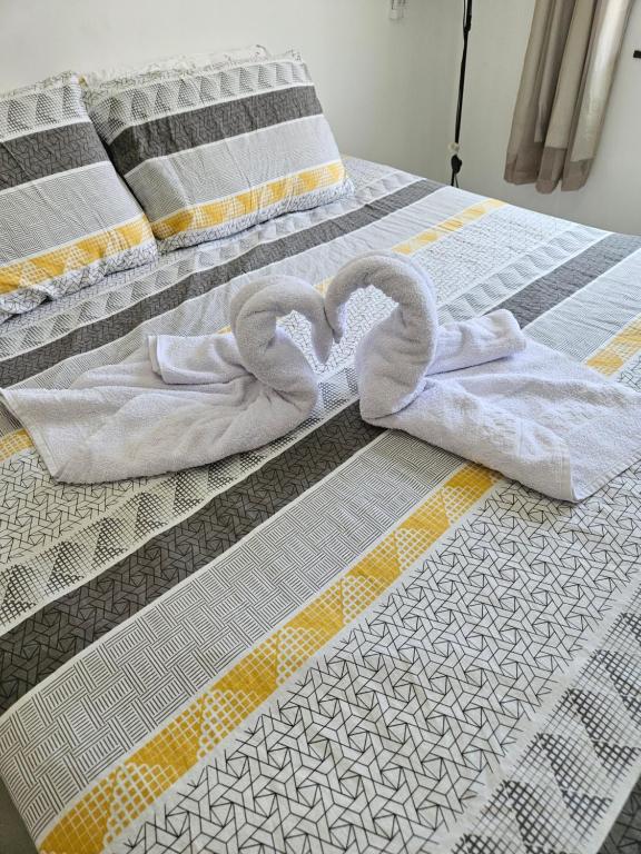 Postel nebo postele na pokoji v ubytování Cantinho do Atalaia à 650 metros da praia - Seu conforto fora de casa