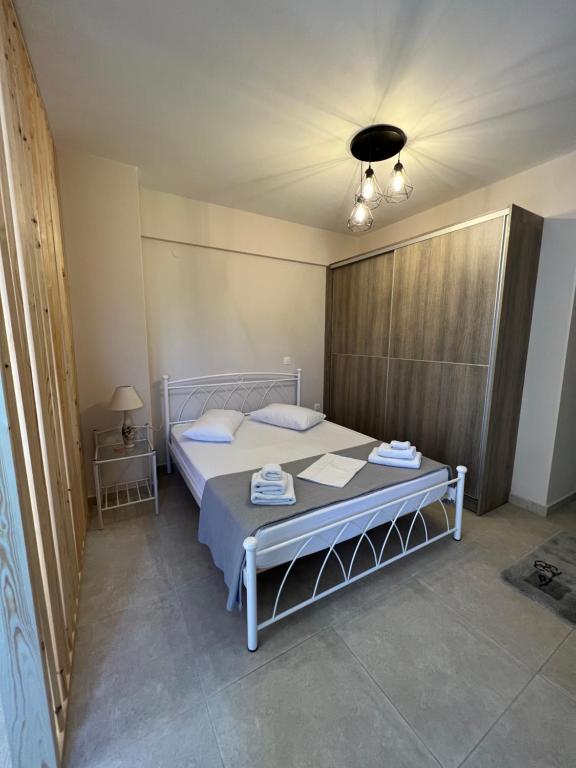 Posteľ alebo postele v izbe v ubytovaní Phil's Apartments