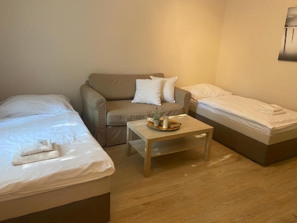 Postel nebo postele na pokoji v ubytování STING Apartments Havířov