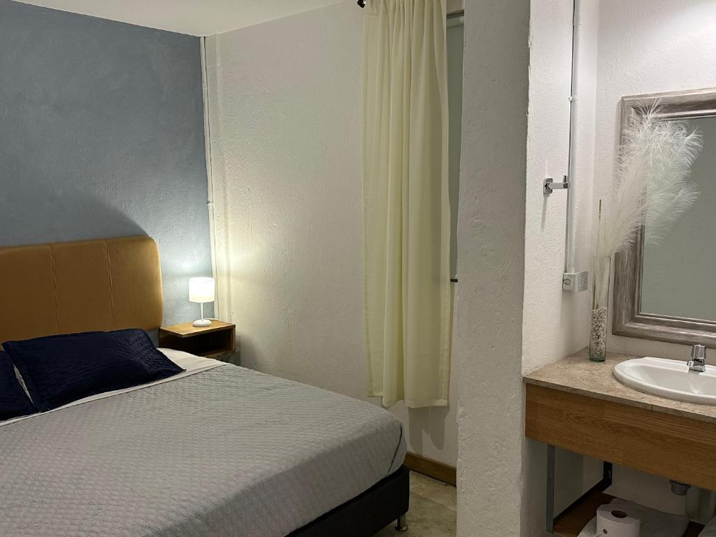 Postel nebo postele na pokoji v ubytování Hotel Casa Lucca