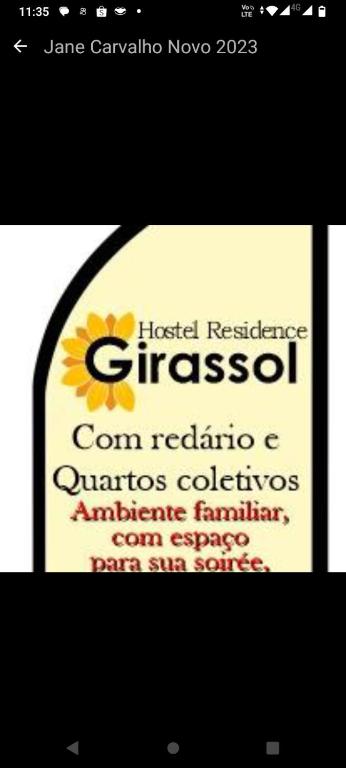 a picture of a sign with a sunflower on it at Hostel girassol in Belém