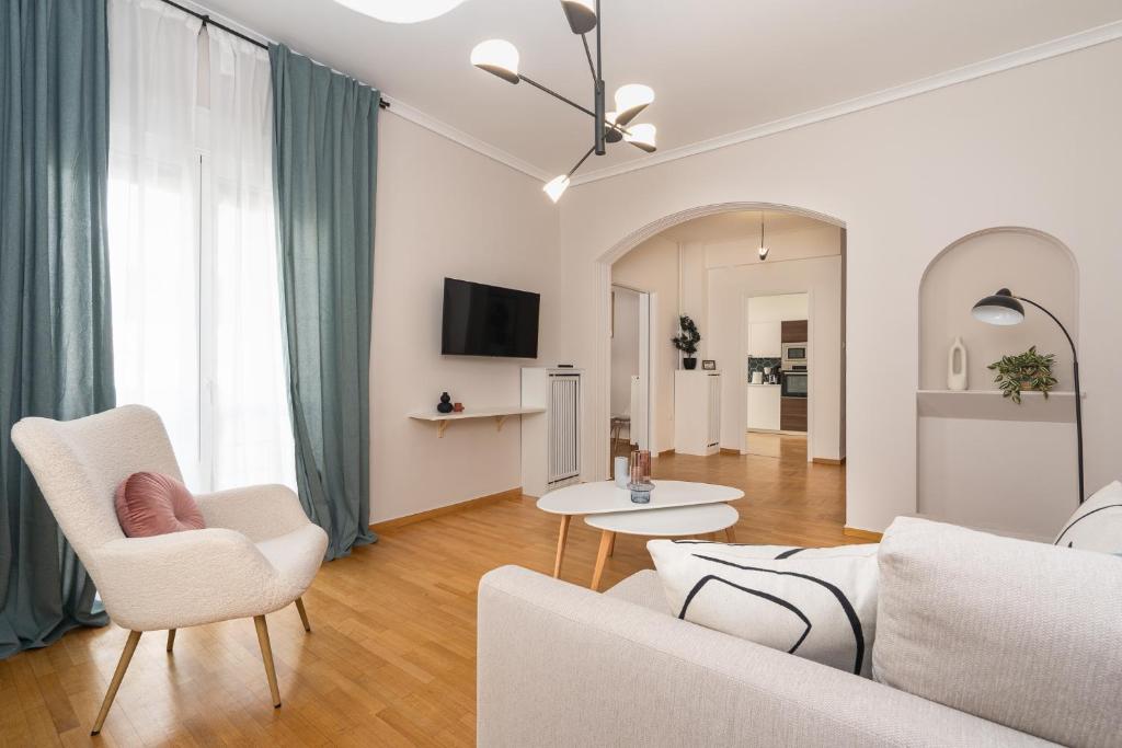 a living room with a couch and chairs and a table at Athenian Classy 2BD Apt next to Metro Panepistimio in Athens