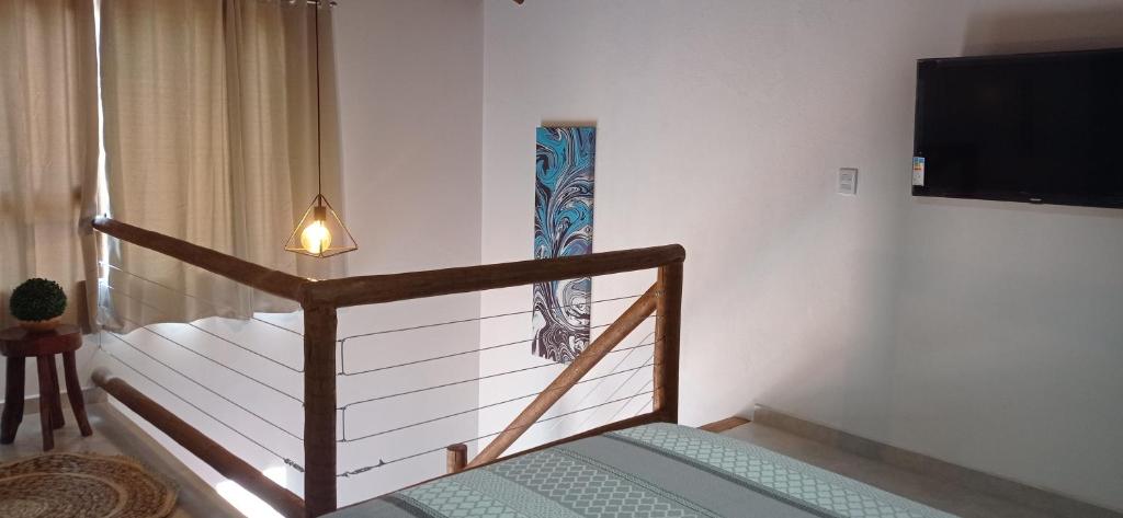 Ένα ή περισσότερα κρεβάτια σε δωμάτιο στο Chalés D'Lis